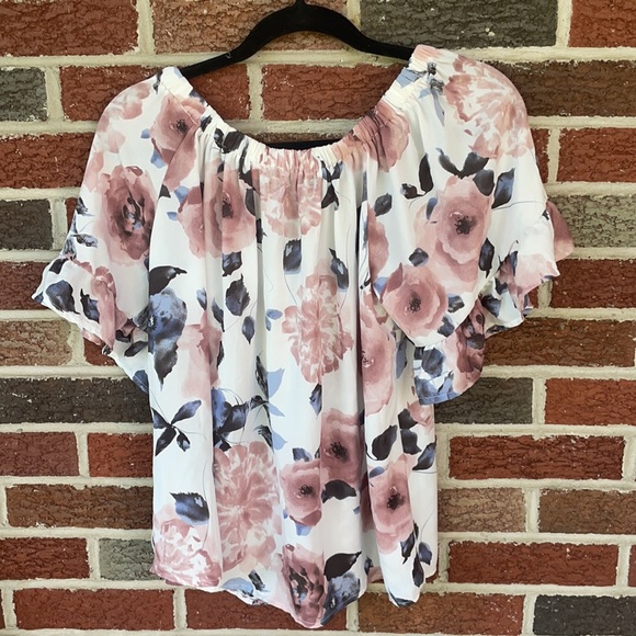 Off the shoulders floral top with ruffles on the arms. Size is a small. - Picture 2 of 2